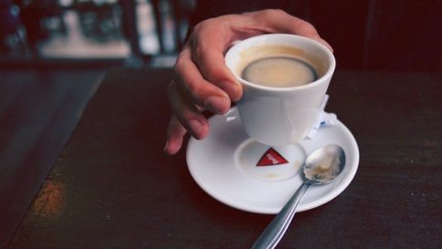 How long is brewed coffee good for, a hand holding a cup of coffee