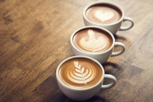 What is a cappuccino, 3 cups of cappuccino with coffee art on top