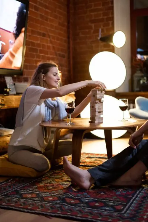 Reasons you want a Table just for Coffee, a woman playing a board game on a coffee table