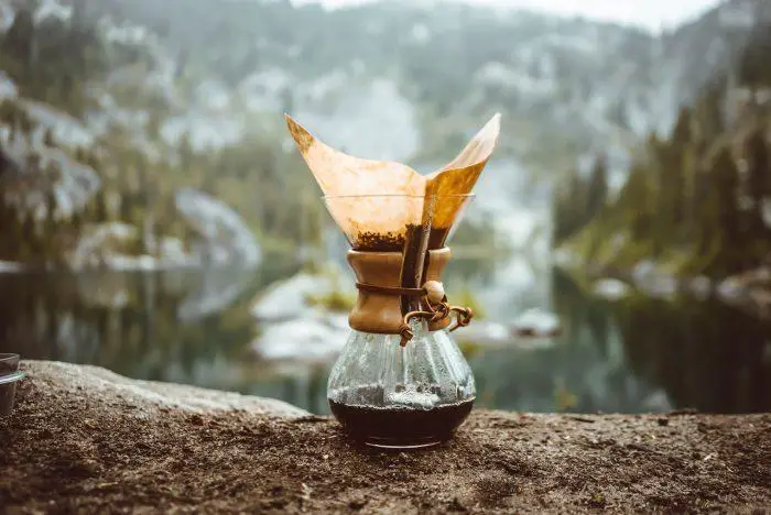 Top 3 Alternative Brewing Methods Catapult Your Coffee Game, a Chemex brewer placed on a rock